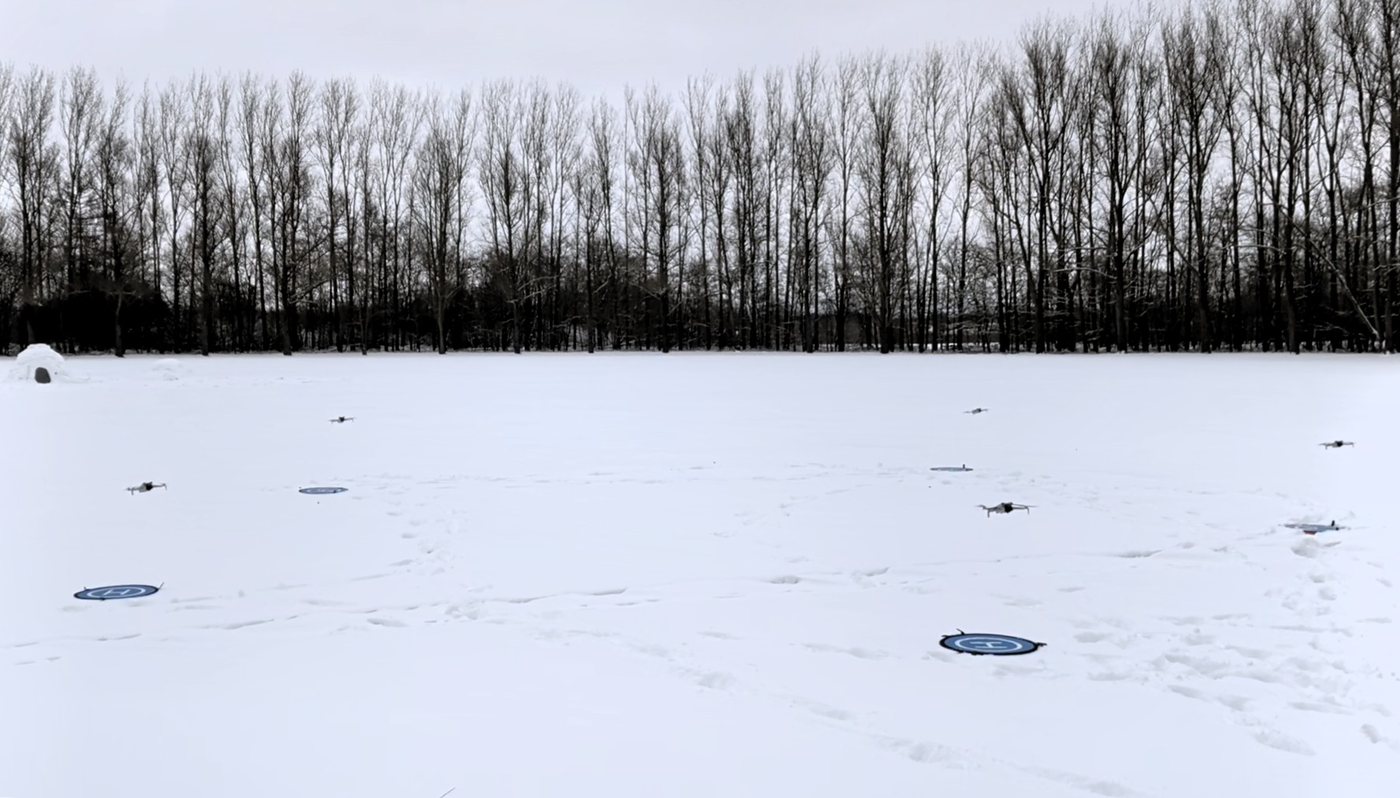 DJI Mini 4 Pro drones taking off in a coordinated formation during the real-world Swarm-Steward validation